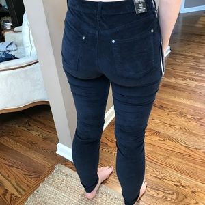 Navy blue Velvet finish skinny pants.